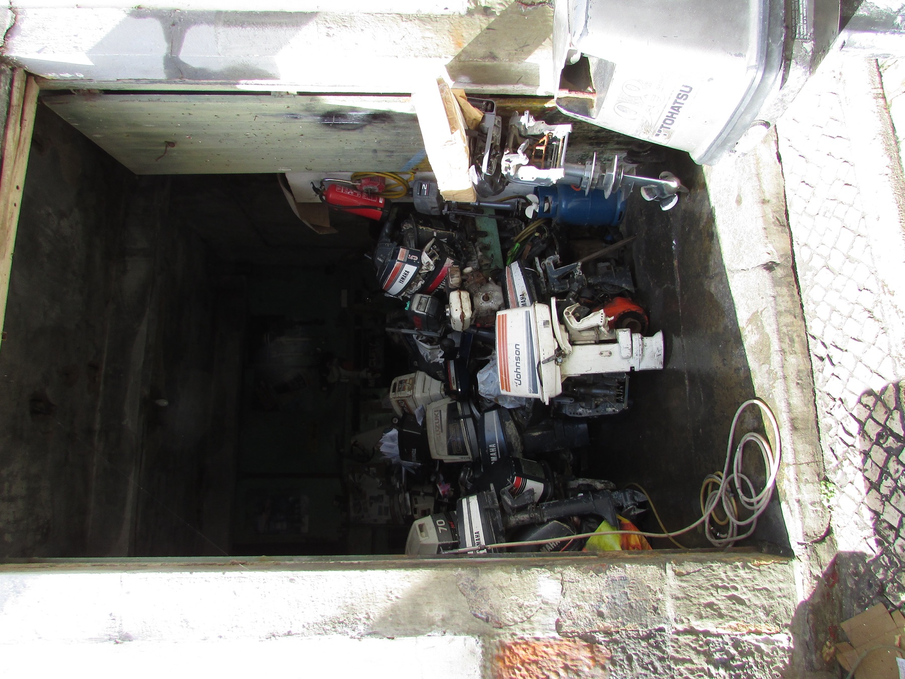 Outboard motor repair at a harbour